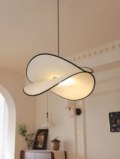 a light fixture hanging from the ceiling in a living room