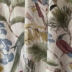 two curtains with birds and flowers on them