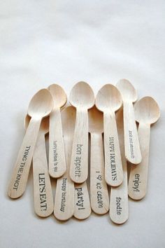 six wooden spoons with labels on them