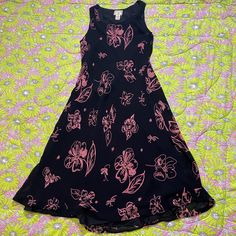 90s whimsigoth vintage April Cornell dress. Allover doodle floral print in pink on black material. Sheer overlay chiffon with a full lining. Pull over with no closure, sleeveless,  maxi - midi length hem, and a scoop neckline. Small pull, please see the photos. Would best fit a S-M, but please see the measurements to ensure a perfect fit. Brand is April Cornell, material is rayon, and original size is a M.  Here to help if you have any questions.   19.5 in chest  47 in length  16 in waist  18 in 90s Whimsigoth, Doodle Floral, April Cornell, Pink Sheer, Sheer Overlay, 90s Dress, Vintage Dress, Dress Clothes For Women, Scoop Neckline