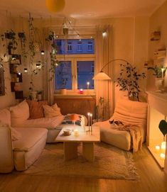 a living room filled with furniture and candles