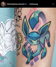 an image of a pokemon tattoo on someone's leg