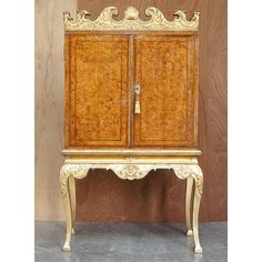 an old wooden cabinet with ornate carvings on it