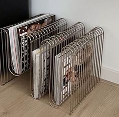 there are many magazines in the metal rack