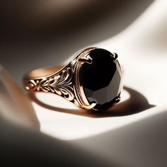 Elegant Black Oval Signet Ring, Black Fine Jewelry Signet Ring For Promise, Elegant Onyx Signet Ring As Gift, Elegant Black Gemstone Signet Ring, Antique Black Rings For Gifts, Elegant Black 14k Gold Signet Ring, Elegant Black Signet Ring For Anniversary, Elegant Black Signet Ring For Formal Occasions, Luxury Black Engraved Promise Ring