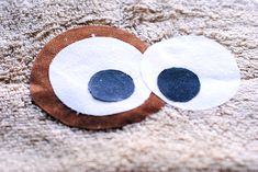 a close up of a piece of felt with eyes on it