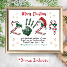 a christmas card with hand prints and candy canes