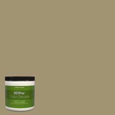 a jar of marquee paint on a green background