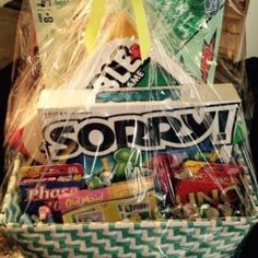 a basket filled with candy and snacks on top of a table