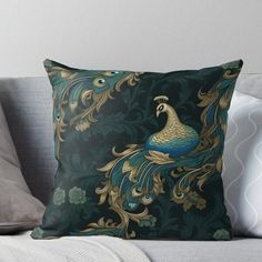 a peacock sitting on top of a couch with green and gold colors throw pillow cover