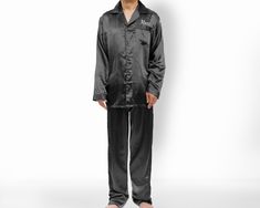 "Luxuriously soft and comfortable, personalized men's satin pajama sets make the perfect birthday gift. These pajamas are made with 97% polyester and 3% spandex for a silky feel. Features include a notch collar, piping along the collar and sleeve cuffs, and an elastic drawstring waistband. They are available in men's sizes M-XXL, so you can find his perfect fit. Get them personalized with his name or initials and make them as special as he is. Front embroidery will be placed ABOVE pocket. Maximu Satin Pajama Sets, Monogram Robes, Embroidered Pajamas, Mens Pjs, Feel Better Gifts, Custom Holiday Gifts, Groomsmen Gift Set, Men's Pajamas, Satin Pajama Set