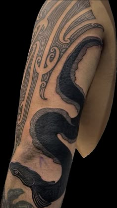 a man with a tattoo on his arm