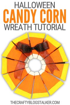 an orange and yellow candy corn wreath with the words halloween candy corn wreath on it