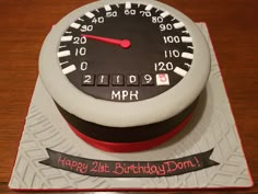 a birthday cake with a speedometer on it