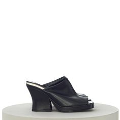 BOTTEGA VENETA WOMEN'S WEDGE MULE SANDALS IN BLACK LEATHER Retailprice: 1250$ Description Leather upper with kid suede sole Round toe Sculptural chunky heel Approx 110mm/ 4.25 inch heel Approx 40mm/ 1.5 inch platform Made in Italy Details Please choose from available sizes Black Leather New in box 100% Authentic — SHIPPING & HANDLING All purchases made are shipped with FEDEX Express International Priority. In order to satisfy our customers, we charge no extra costs at all for this service. Full track & trace is available for your purchase on Fedex's website. Tracking information will be mailed to the paypal email address used with your payment. If you do not receive this email, please check your spambox. The tracking number will also be added to your purchase on eBay. Please do note that w Calf Leather Open Toe Mules With Reinforced Heel, Modern High Heel Sandals With Sculpted Heel, Designer Calf Leather Mules With Sculpted Heel, Black Calf Leather Mules With Sculpted Heel, Designer High Heel Mules With Sculpted Heel, Luxury Sandals With Sculpted Heel And Square Toe, Black Luxury Mules With Sculpted Heel, Luxury Black Mules With Sculpted Heel, Modern Wedge Sandals With Sculpted Heel And Open Toe