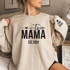 Check the T-Shirt here : https://lovefashionnn.etsy.com/listing/1772537785 Looking for a personalized gift for a mom of twins? Wrap yourself in the warmth of maternal love with our Personalized Twin Mama Sweatshirt, a cozy embrace that celebrates the unique bond between a mom and her twins. This Custom Twin Mom Sweater is more than just apparel; it's a testament to the joy and pride of motherhood.           Customized with the names of her beloved boys delicately printed on the sleeve, this swea Mom Of Twins, Mama Sweater, New Mama, Mom Sweater, Gift For Mothers Day, Twin Mom, Deep Connection, Sweater Gift