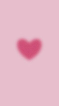 a heart shaped shadow on a pink background