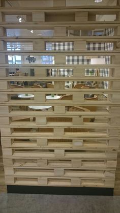 a very large wooden dresser with lots of drawers on it's sides and mirrors in the back