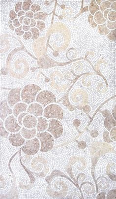 an old tile wall with flowers and swirls on the bottom, as well as a pattern