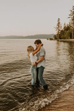 a man and woman embracing in the water