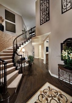 a large foyer with stairs leading up to the second floor