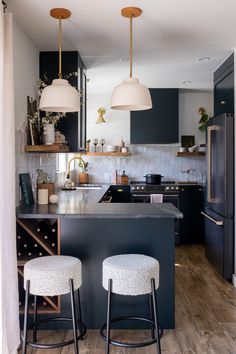 two stools are in front of the kitchen island