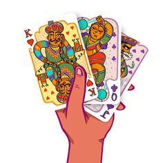 a hand holding four playing cards in different colors