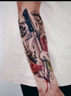 a man with a knife tattoo on his arm