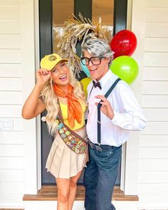 a man standing next to a woman in front of a door wearing a hat and tie