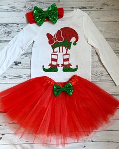 This elf design is made from beautiful glitter art. The sparkly, glitter design does not shed, and is professionally applied to your choice of size of a Carters white bodysuit or tshirt. A perfect choice for Christmas! **Please hand-wash the shirt inside out in cold water and lay flat to dry. The TUTU- is made from 3 layers of tulle with a sequin bow that is attached with a clip so it can be removed and used as a hairclip also! HEADBAND is one sequin bow on elastic. You can order this in size Ne Festive Red Holiday Sets, Holiday Festive Red Set, Festive Red Holiday Set, Cute Fitted Christmas Sets, Cute Red Christmas Sets, Cute Red Festive Sets, Cute Christmas Holiday Sets, Christmas Outfit Red, Elf Outfit