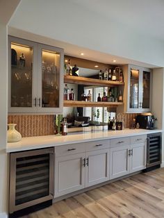 a large kitchen with lots of cabinets and counter top space in front of the sink