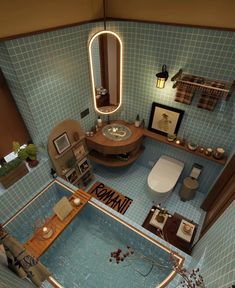 an aerial view of a bathroom with blue tile walls and flooring, including a bathtub