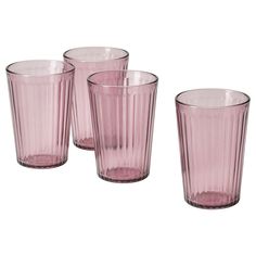 four pink glass tumblers sitting next to each other