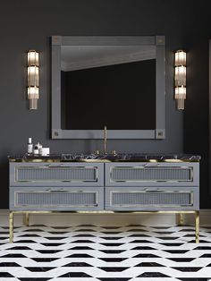 a bathroom vanity with two sinks and a large mirror above it in a dark room