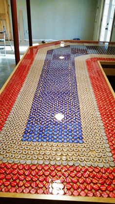 a table made out of red, white and blue material with circles on it's surface