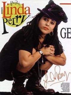 an image of a magazine cover with a woman in black outfit and hat on the cover