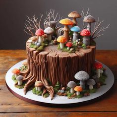 a cake decorated with mushrooms and trees on a plate