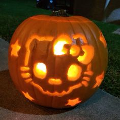 a pumpkin carved to look like a cat