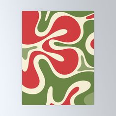 a red, green and white abstract pattern on canvas mounted to a wall in a room