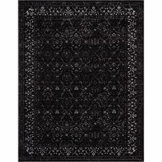 a black and white rug with an intricate design