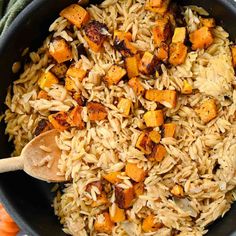 a pan filled with rice and sweet potatoes