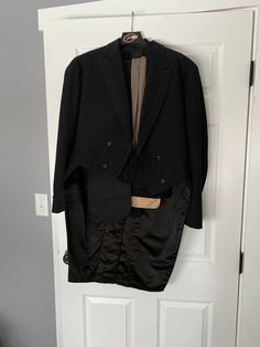 "Incredible full men's tuxedo ensemble from the year 1906. Belonged to a man named Edmund Murphy and dated July 26, 1906 on the interior label (inside pocket). Includes tuxedo pants, tuxedo jacket, vest, black cummerbund, and a tan scarf. Overall great condition! Sturdy and wearable. The only problem spots are that the lining of the cummerbund is cream silk is shattering just a little, the covered buttons are losing their fabric, and there is a group of stain spots and a few small holes on the scarf. Shown in photos.  Men's small/medium Pants: 32\" waist 38\" hips 44.25\" waist to hem 34\" inseam 13\" rise Cummerbund: 48\" length 4\" wide at center, 7\" wide at edges Gray scarf: 62\" long (excluding fringe) 8.5\" wide Vest: 38\" chest 32\" waist 20.5\" shoulder to hem (22\" shoulder to cen Classic Fitted Blazer For Costume, Fitted Classic Blazer For Costume, Fitted Formal Uniform Suit, Vintage Double Breasted Fitted Suit For Formal Occasions, Vintage Fitted Double Breasted Suit For Formal Occasions, Vintage Double Breasted Fitted Suit, Vintage Black Suits For Business, Vintage Black Business Suit, Vintage Fitted Three-piece Suit For Formal Occasions