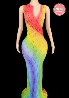 a mannequin wearing a rainbow colored dress