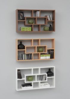 two shelves with books and other items on them