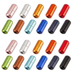 an assortment of different colored metal knobs