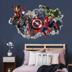 the avengers wall sticker is shown in this bedroom