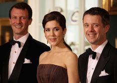 two men and a woman in formal wear