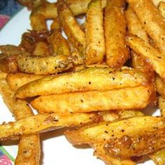 french fries on a plate with seasoning