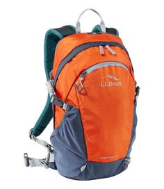 an orange and blue backpack sitting on top of a white background