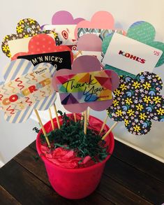 there is a potted plant that has been decorated with paper hearts and thank you notes